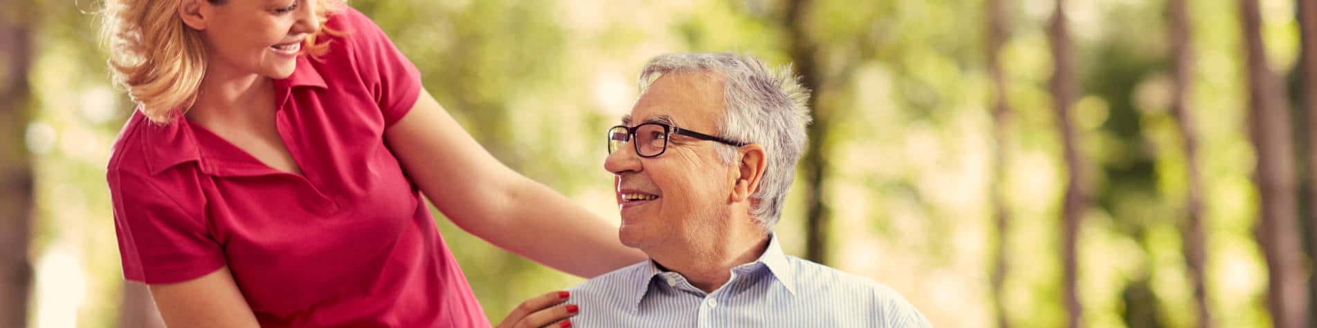 Elderly Man and a Younger Woman Smiling at Each Other
