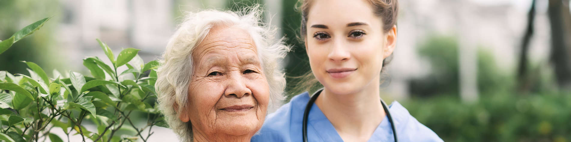 Caregiver Sitting with Her Elderly Client