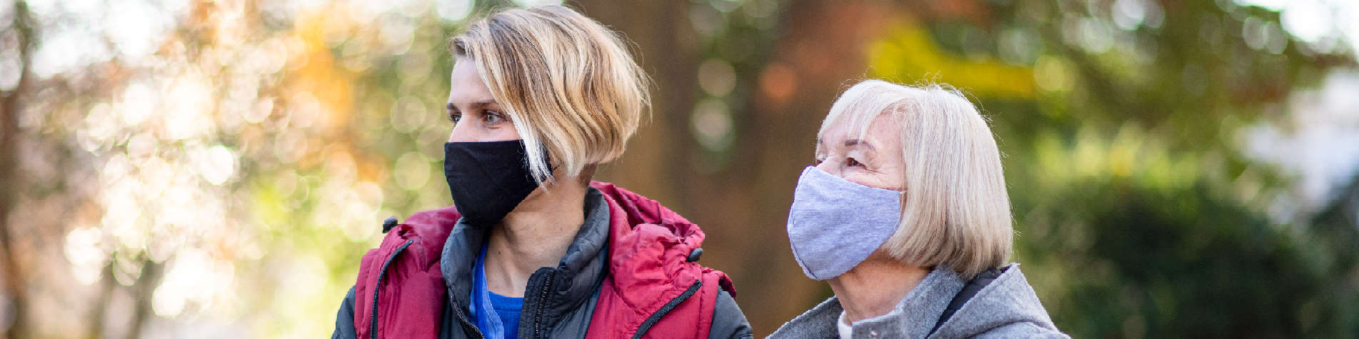 Caregiver with Her Elderly Client in a Park
